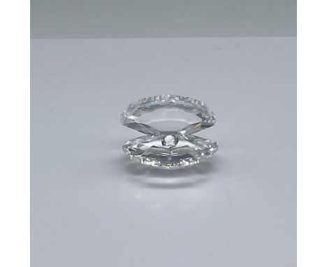 Beautiful small oyster sitting with it's shell opened to reveal a tiny crystal pearl. Swarovski etched backstamp. This item h