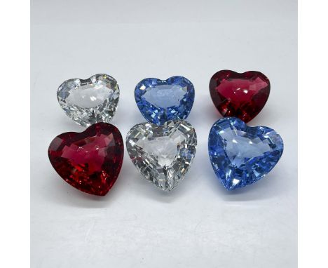 Lovely, faceted crystal hearts presented in clear, blue and red. This item has its original boxes: 4"L x 6"W x 1.5"H and 2.5"