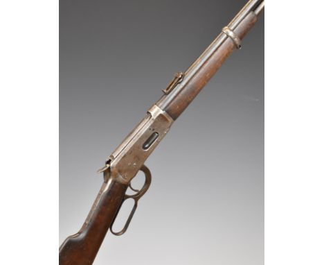 Winchester Model 1894 .30 WCF underlever repeating carbine rifle with adjustable pop-up ladder sights, steel butt plate and m