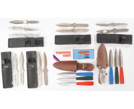 Seven sets of throwing knives, all in pouches, two sets with coloured handles, the longest blade 9.5cm PLEASE NOTE:- Before b