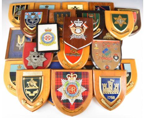 Approximately twenty four wall plaques including Special Air Service, 1st The Queen's Dragoons Guards, Durham Light Infantry,