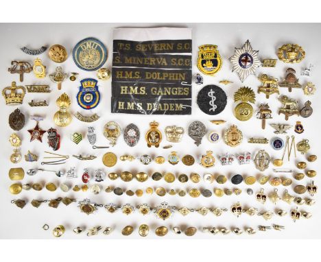Approximately sixty military badges, buttons, rank insignia etc, including Royal Navy cap tallies, shoulder titles, 12th Roya
