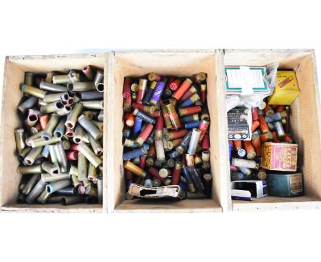 Over six hundred mainly paper and brass cased collector's shotgun cartridges in three wooden ammunition crates stamped 'Pneum