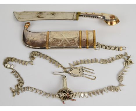 Eastern dagger with decorated grip, 16cm wide blade and decorated scabbard with chain PLEASE NOTE:- Before bidding please ens