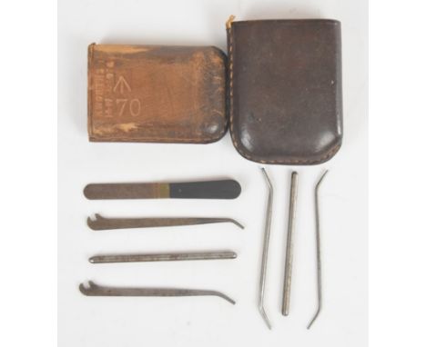 WW1 British small tools / instruments housed in a leather vesta sized holder, marked K Worth 1916 with broad arrow mark 70
