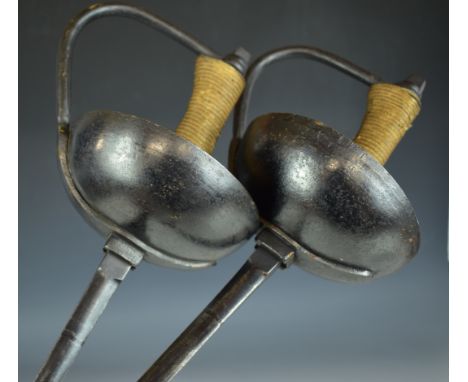 A pair of duelling epées / rapiers with bound grip, thumb rest and leather finger loop and 87cm blades with clipped ends PLEA