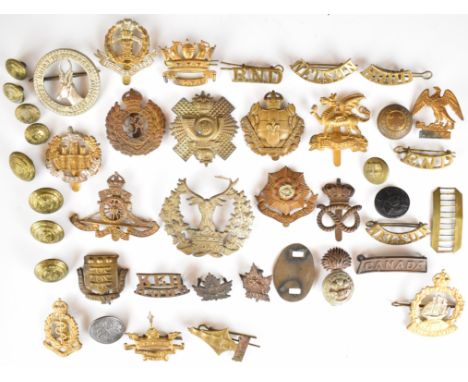 Collection of military badges and buttons including Royal Naval Division, Drake, Hood, Nelson, Howe, Highland Light Infantry,