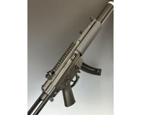 German Sport Guns (GSG) 522 .22 semi-automatic assault style rifle with textured pistol grip, tactical stock, three curved mu