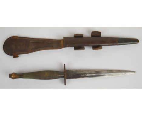 Fairbairn Sykes second pattern fighting knife with broad arrow mark to crosspiece, 16.5cm double edged blade (tip missing) an