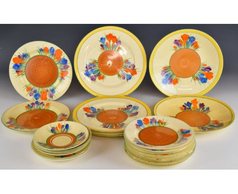 Clarice Cliff for Wilkinson and Newport Pottery twenty four plates and saucers decorated in the Crocus pattern, largest diame