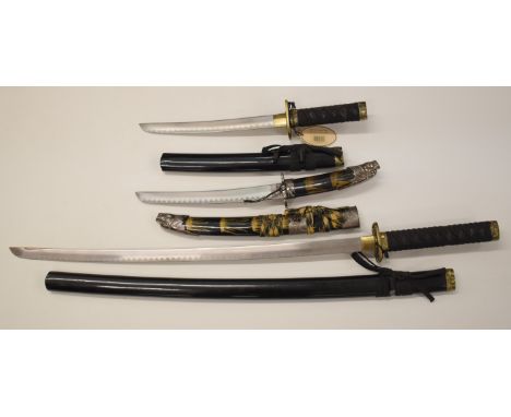 Three Ancient Warrior Japanese Samurai swords comprising a katana and two wakizashi all with bound handles and lacquered scab