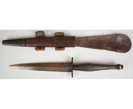Fairbairn Sykes second pattern fighting knife by Wilkinson, with 16cm double edged blade (tip missing) and leather sheath PLE