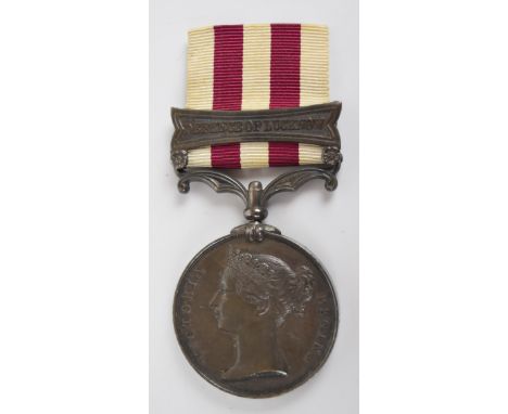 British Army Indian Mutiny Medal with clasp for Defence of Lucknow, named to Sgt W J McNeil, 32nd Light Infantry, with copy s