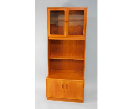 A G Plan teak display cabinet, with two glazed doors enclosing a single glass shelf, raised over a further open shelf, above 