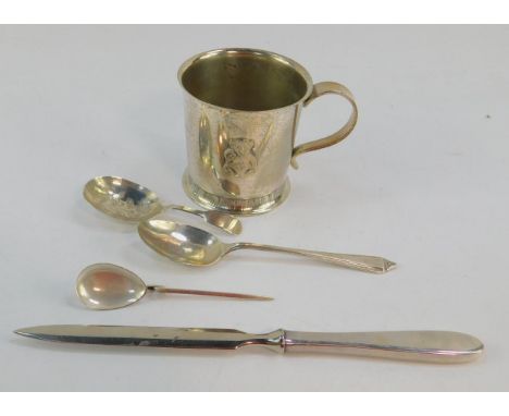 A George III silver caddy spoon, George VI jam spoon, Sheffield 1946, further spoon, paper knife, stamped 925, 3.01oz, and a 