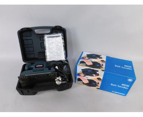 A Nupower 810w belt sander, boxed, together with a Rockworth power task sheet sander, with instructions, both boxed,  (2).