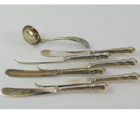 A George VI silver cream ladle, Sheffield 1937, and six George V silver handled cake knives, Sheffield 1934, 5.15oz all in.