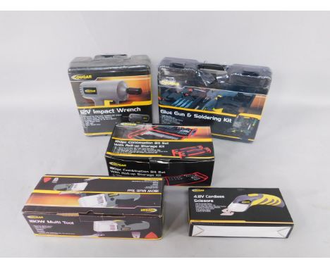 A Cougar glue gun and soldering kit, 12volt impact wrench, 180w multi tool, 4.8v cordless scissors, and a 180 piece combinati