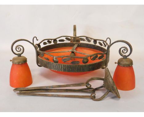 A French early 20thC cast iron and mottled orange glass ceiling light, the central foliate frame with a demi lune shade, with
