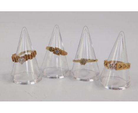 Two 9ct gold and diamond solitaire rings, high claw illusion set, sizes P & R, and two 9ct gold and zircon set rings, sizes J