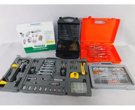 A Handy 6 in 1 7.2 volt workshop, a drill set, a Work Expert multi tool set, a Hilka 40 piece drill and bit set, and a Footpr