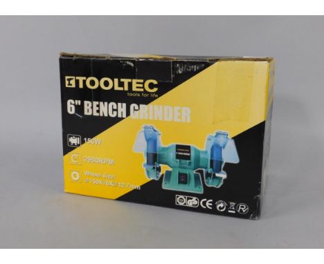 A Tool-Tech 6" bench grinder, in original box.