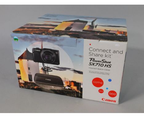 A Canon Power Shot SX710HS connect and share kit, with connect station CS100, boxed.