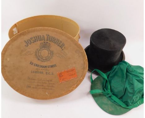 A Herbert Johnson black top hat, 20cm x 16cm interior dimensions, in a Joshua Turner hat box, named to Captain C A R COGHILL,