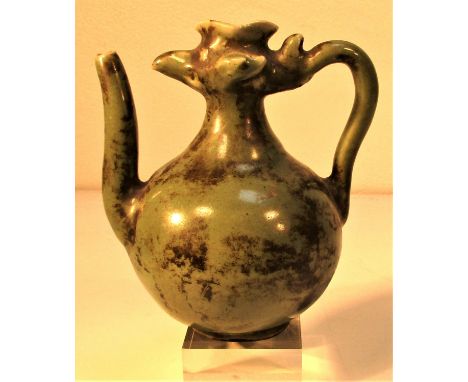 Bali. Ceramic medicine or saki jug in form of cockerel with green glaze. 9cm diam. X 12cm. Late 20th c. 