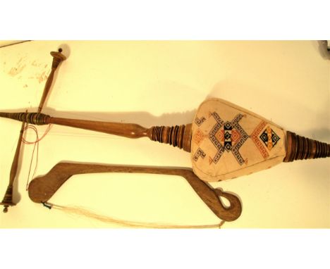 Gamelan  A two string instrument played with a bow from Bali. Finely turned from Jempinis wood. The face of the sound box is 