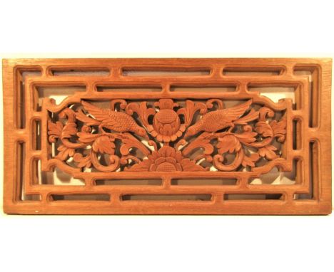 Carved hardwood panel from Bali showing two birds. These are placed at the top of an outside wall to improve ventilation. 70 