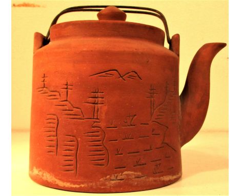 Ceramic tea pot with leaf strainer and metal handles. Decorated in Chinese style. The stamp on the bottom is from a ceramic f