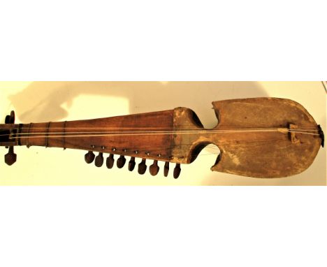 Rabab  musical instrument from Afghanistan.  The sound box is carved out of one piece of mulberry wood. It has three melody s