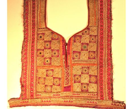 Hazara dress front. Women and children of most tribes in central Asia wear a long dress with an embroidered panel at the fron