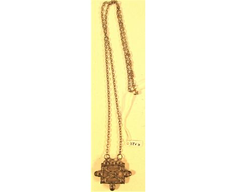 A  pendant of an antique white metal amulet from Afghanistan on a chain. 32cm. 