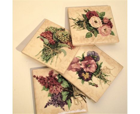 Set of 4 ceramic coasters with flower designs. 4 rubber cushion pads on bottom. Stored in display box, white designer stresse