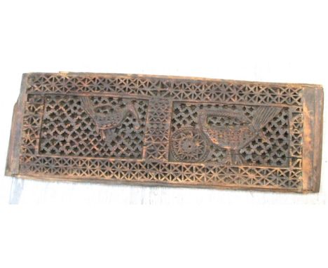 Carved wood panel. This exquisite panel was the front of a chest from Nuristan in the very east of Afghanistan.  The two peac
