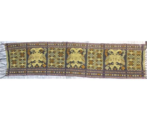 Ceremonial sash from east Sumba with a pattern of mythical birds and geometric patterns worked in cotton on cotton ground in 