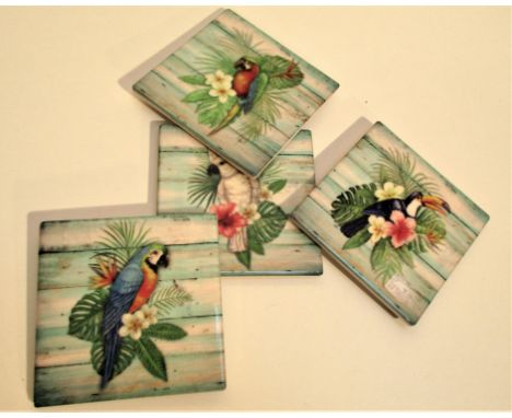 Set of 4 ceramic coasters with exotic bird and flower designs. 4 rubber cushion pads on bottom. Stored in display box, white 