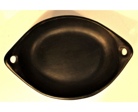 Ceramic bowl from Lombok. The clay is soaked in coconut oil after first firing,. The second very hot firing turns the vessel 
