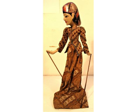 Wayang Golek from Java. A very demure looking puppet well dressed in a  batik sarong. The wayang golek plays are very similar