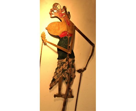 Wayan kulit, shadow puppet from Bali. The silver paint on the face is to shine when lit by an oil lamp. 75 x 20cm. Mid 20th c