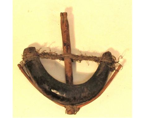 Bird or trap for a very large mouse. Made from a goat horn in Java. A truly ethnic domestic item. It does have a very effecti
