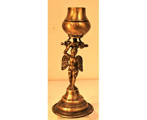 Brass oil lamp from Nepal with an cherub holding the oil container. 25 x 10cm. Late 20th C. 