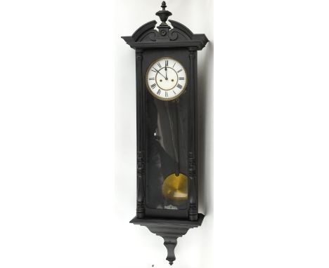 Vienna regulator style wall clock, the black painted case with arched pediment and urn finial above twin pilasters, the ename