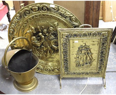 Helmet shaped coal scuttle, chased with a floral design, 47 cm high, two other coal buckets, fire irons set, fire screen and 