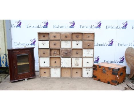 Stained beech wall hanging corner cupboard, painted pine chest of twenty-five drawers in a 5 x 5 configuration, and a pine an