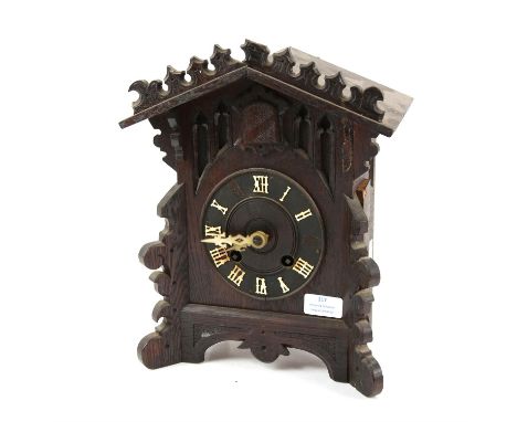 Cuckoo mantel clock, with scroll carved case, the twin train movement striking on a gong with bellows, H33, W25 cm