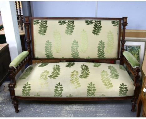 Late 19th century walnut framed sofa with green foliage fabric upholstery with carved frame on turned and carved supports, h1