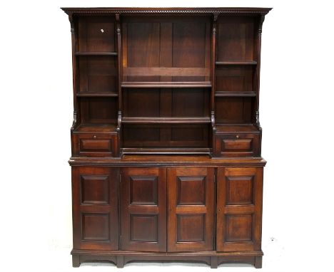 19th century mahogany dresser and rack, the top with dentil cornice and turned pilasters over shelves and trinket drawers ove